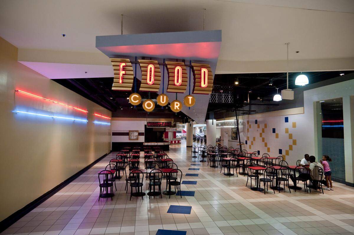 The neon was still bright and the floors were still polished, but the scene at Eastland Mall's food court had faded in this file photo