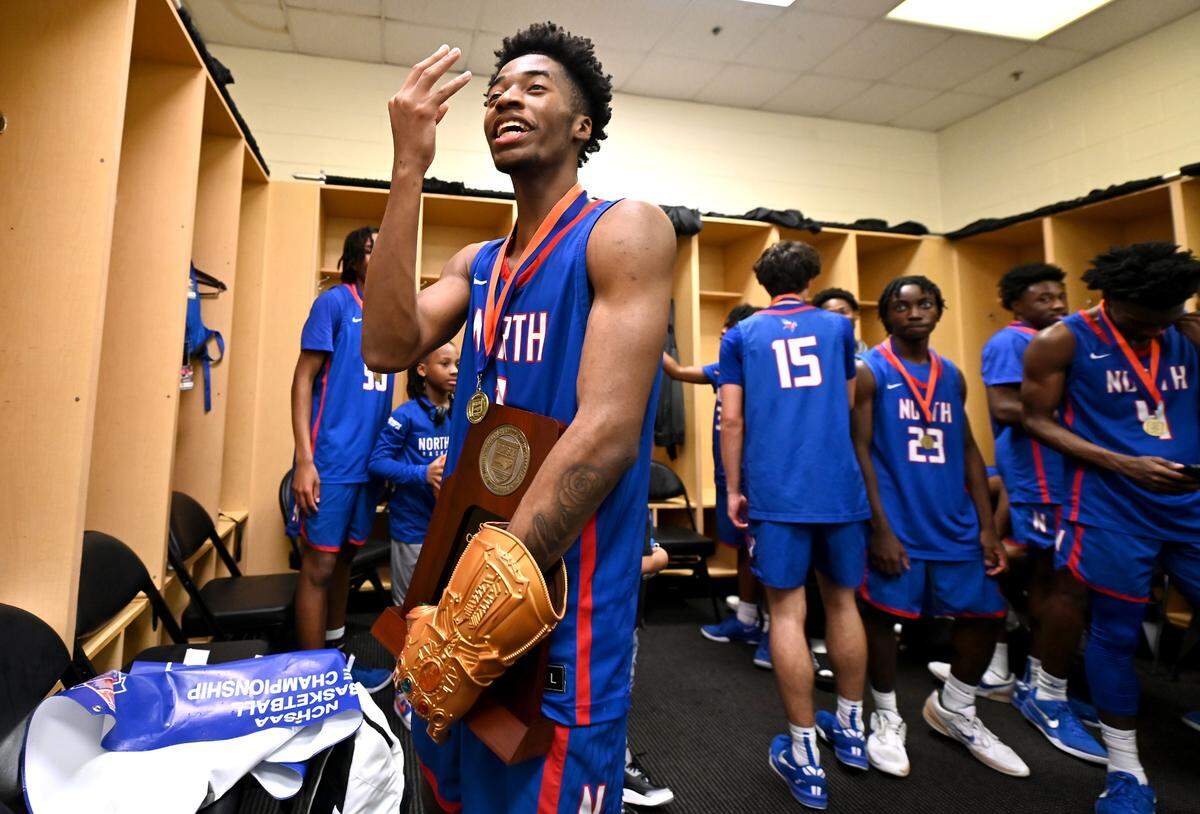 North Meck Vikings Chadlyn Traylor flashes a three after winning his third state championship on Saturday, March 15, 2025. The North Meck Vikings defeated New Hanover 59-56 in the boys NCHSAA 4A State Championship game at Lawrence Joel Veterans Coliseum in Winston-Salem, NC.
