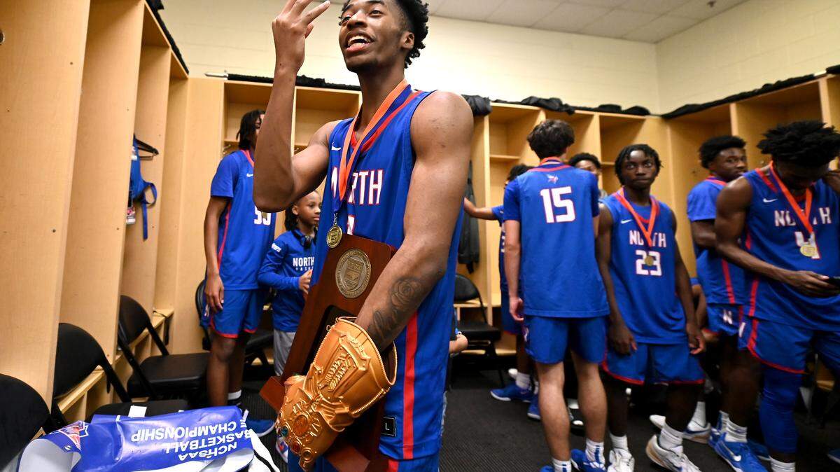 North Meck Vikings Chadlyn Traylor flashes a three after winning his third state championship on Saturday, March 15, 2025. The North Meck Vikings defeated New Hanover 59-56 in the boys NCHSAA 4A State Championship game at Lawrence Joel Veterans Coliseum in Winston-Salem, NC.