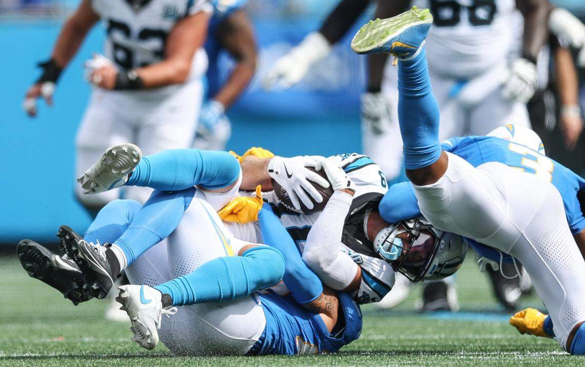 Panthers wide receiver Adam Thielen is tackled after a catch during the game against the Chargers at Bank of America Stadium in Charlotte, NC on Sunday, September 15, 2024.