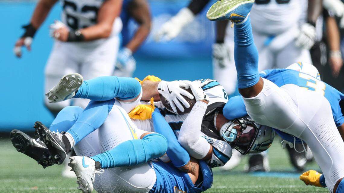 Panthers wide receiver Adam Thielen is tackled after a catch during the game against the Chargers at Bank of America Stadium in Charlotte, NC on Sunday, September 15, 2024.