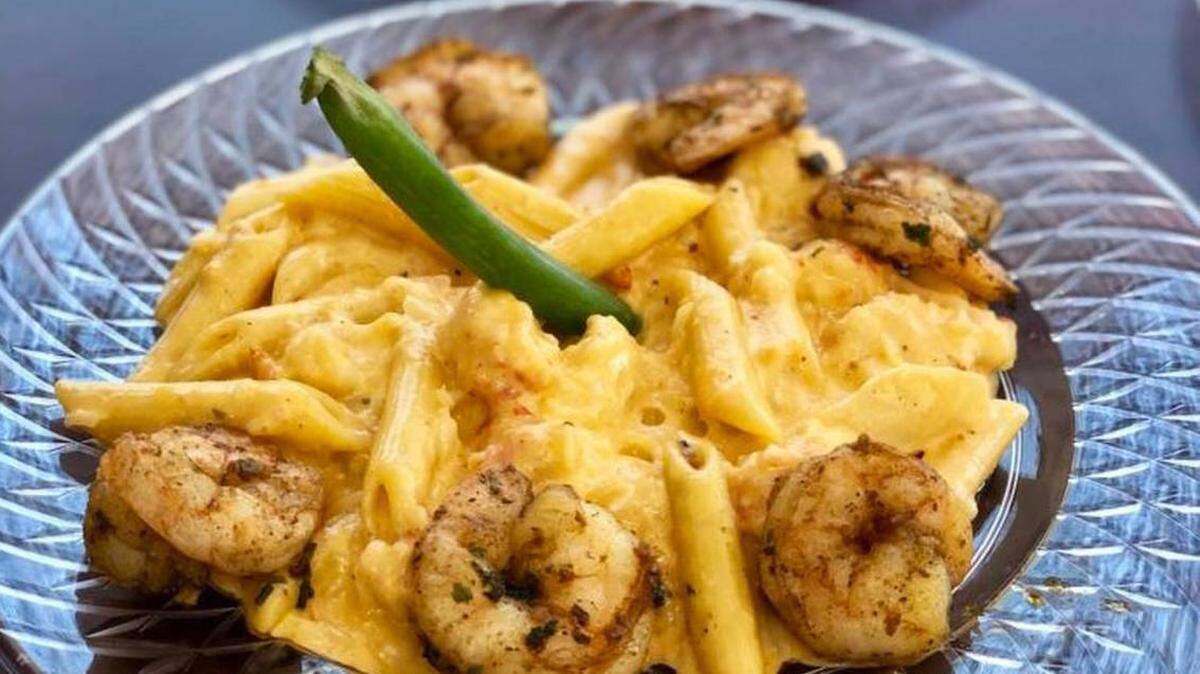 Cuzzo’s Cuisine Lobster Mac and Cheese is served with a side of shrimp.
