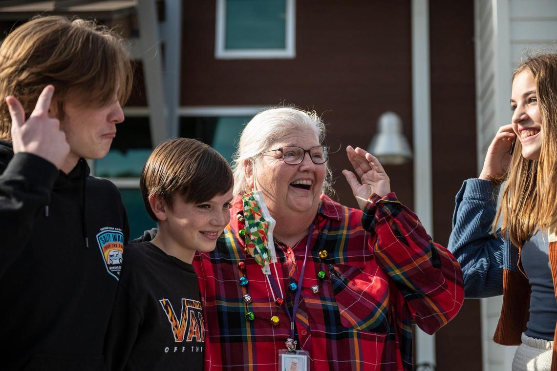 Debbie Arias, a preschool teacher at The Learning Tree at Lake Forest Church, is joined by her grandchildren, Kevin, Kaden and Katelyn as she is surprised with a new Toyota Prius on Friday, December 17, 2021 in Huntersville. After learning that her minivan needed thousands of dollars worth of repairs, a parent, Whitnie Sharp, started a Go Fund Me campaign to get her the money to fix it. After receiving more money than expected from fellow parents and members of the church, the Mike Johnson Hickory Toyota dealership in Hickory caught wind of the efforts and decided to gift her a “new” used car.