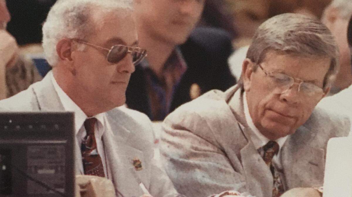 Leonard Laye (left) and Ron Green Sr. cover a basketball game together for The Charlotte Observer. Laye died Wednesday at age 78.