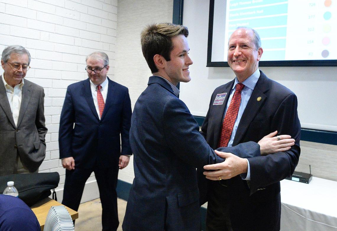 Dan Bishop gets a hug from his son Jack Bishop after he addressed supporters Tuesday night. Bishop easily won Tuesday’s 9th District Republican primary, three months after state officials took the unprecedented step of throwing out a 2018 election marred by fraud allegations.