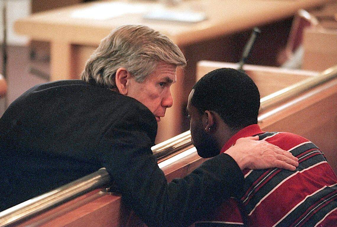 Prosecutor Gentry Caudill consults with one of Cherica Adams’ family members shortly before the verdict.  Caudill, like defense attorney David Rudolf, was disappointed when the verdict was announced.