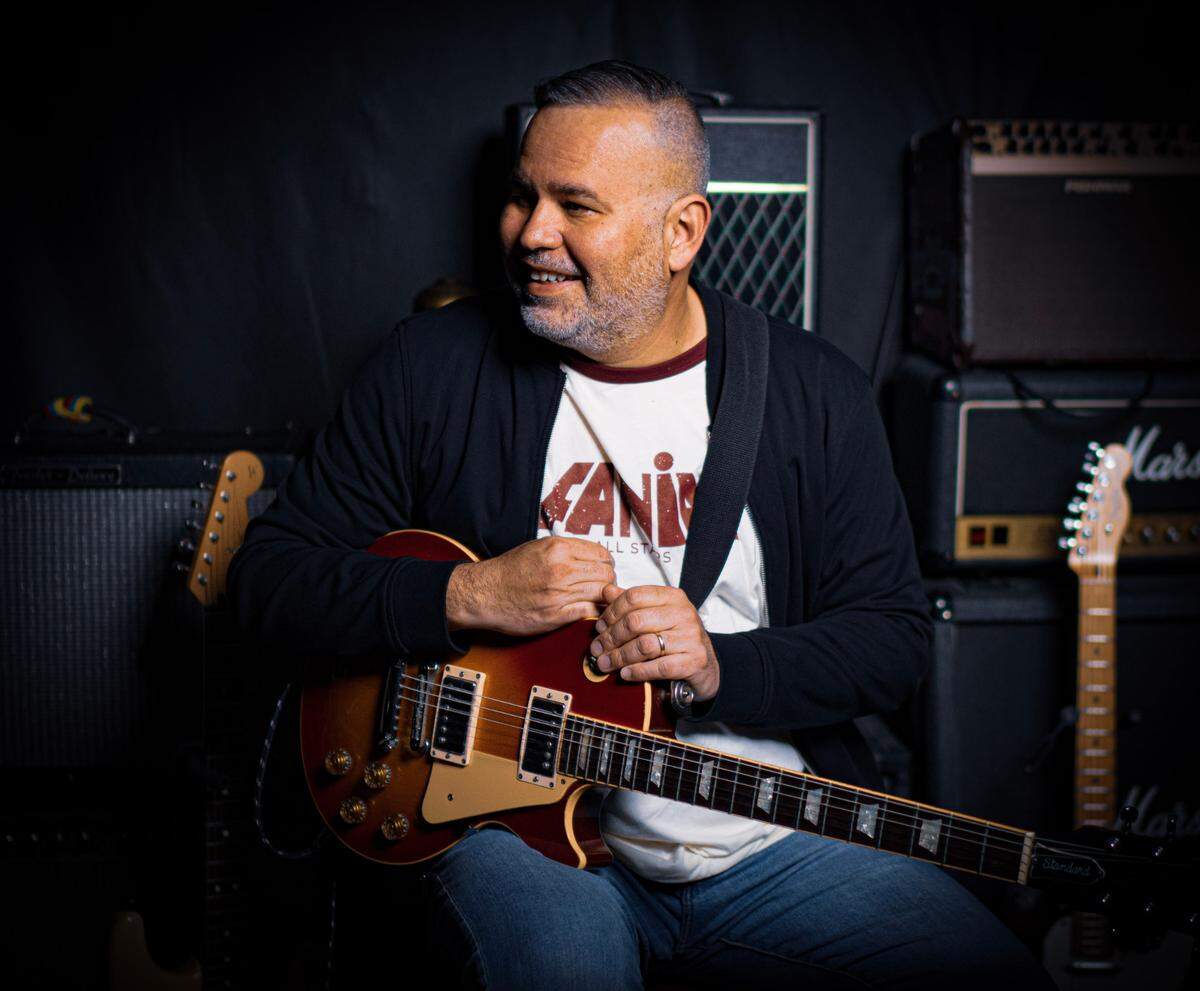 Tony Arreaza founded Charlotte-based Carlotan Talents and is the guitarist in the local Latin band UltimaNota.