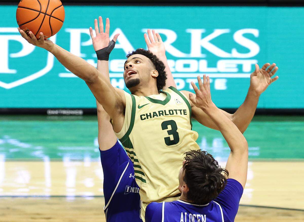 Charlotte 49ers guard Ben Bradford drives to the basket for two points against the Indiana State defense on Monday at Halton Arena. Charlotte defeated Indiana State 92-76.