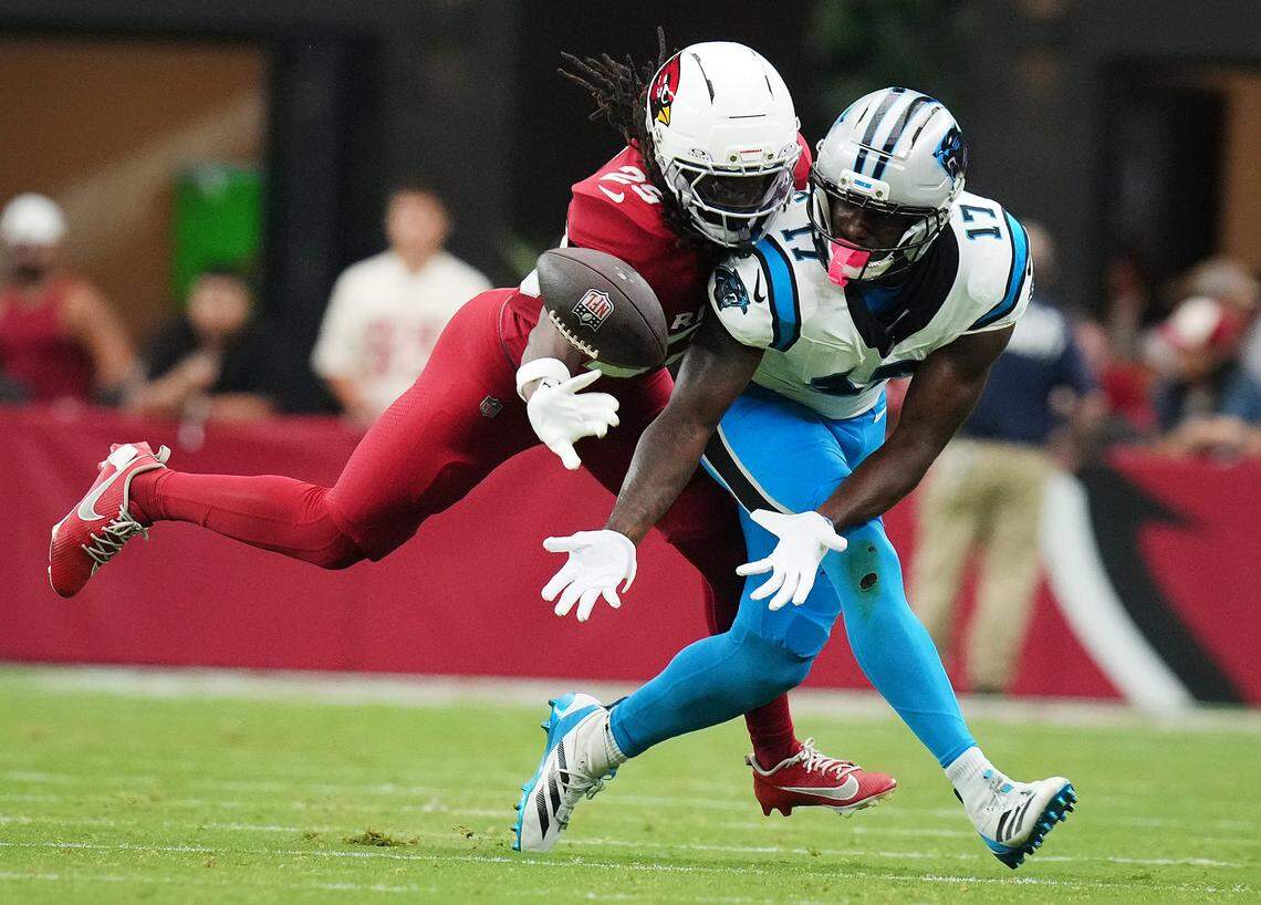 Arizona Cardinals cornerback Denzel Burke (29) makes a defensive stop against Carolina Panthers receiver Xavier Legette (17) at State Farm Stadium on Sunday. While Legette was targeted eight times for Carolina, he only came up with one catch, for minus-2 yards.