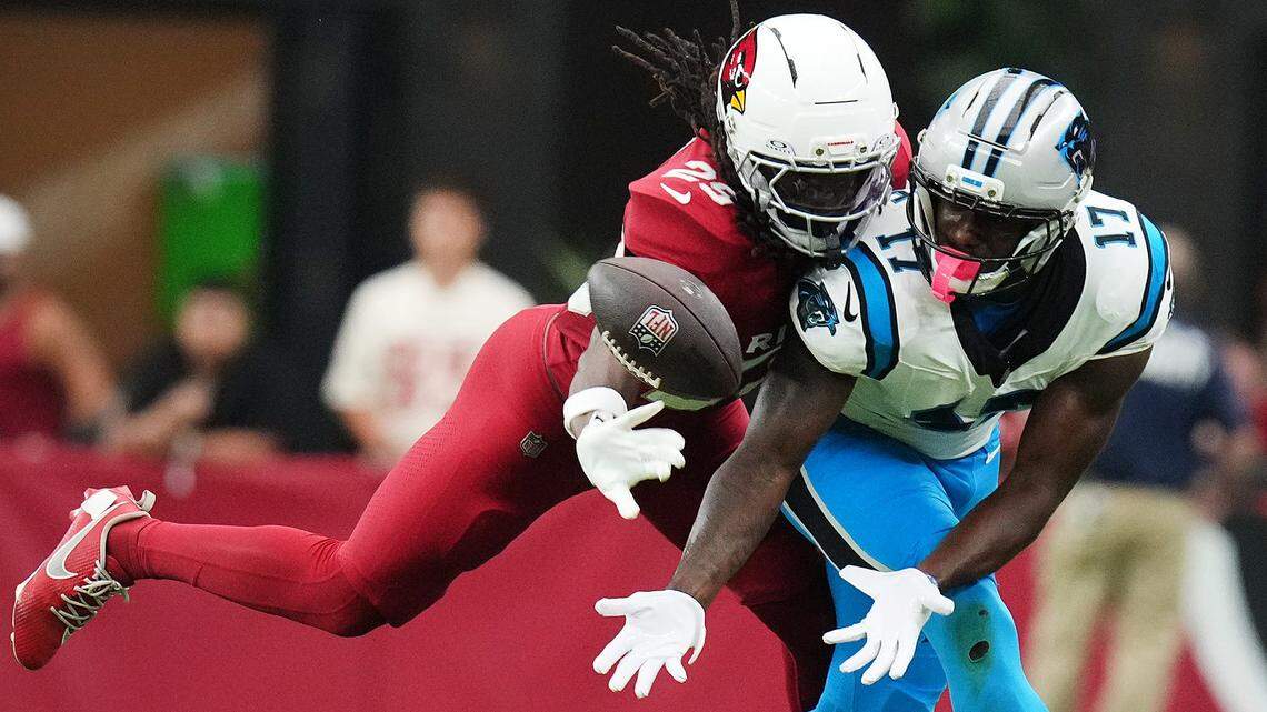 Arizona Cardinals cornerback Denzel Burke (29) makes a defensive stop against Carolina Panthers receiver Xavier Legette (17) at State Farm Stadium on Sunday. While Legette was targeted eight times for Carolina, he only came up with one catch, for minus-2 yards.