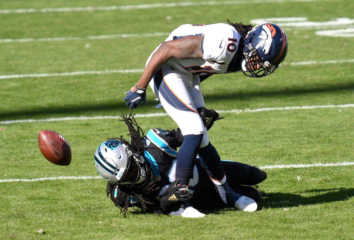 Carolina Panthers cornerback Donte Jackson (26) deflects a pass intended for Denver Broncos wide receiver Jerry Jeudy (10) during their game at Bank of America Stadium in Charlotte, NC on Sunday, December 13, 2020. The Broncos won 32-27.