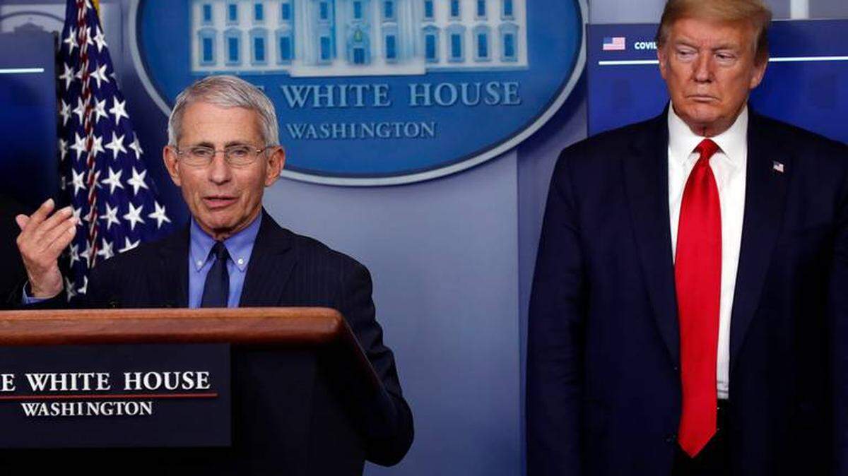 President Donald Trump listens as Dr. Anthony Fauci speaks about the coronavirus in April 2020. This week, six of Trump’s former pandemic advisers, including Fauci, criticized his administration’s handling of the pandemic response.