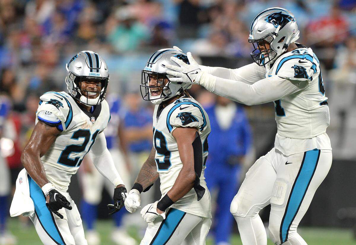 Carolina Panthers safety Jeremy Chinn, left and defensive end Darryl Johnson, right, congratulate linebacker Frankie Luvu, center, after Lulu’s stop of a Buffalo Bills run during second quarter action at Bank of America Stadium in Charlotte, NC on Friday, August 26, 2022.