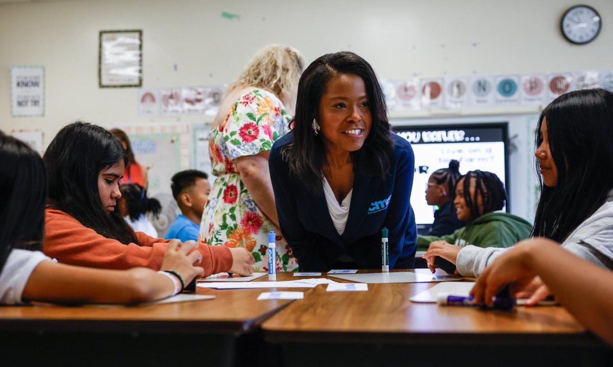 CMS Superintendent Dr. Crystal Hill speaks with third grade students during the first day of school at Idlewild Elementary School in Charlotte, NC on Monday, August 26, 2024.