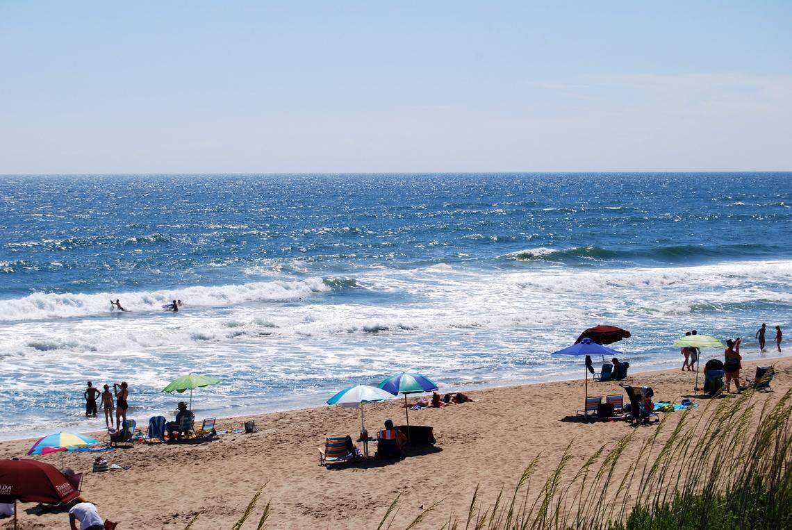 Beachgoers relax at Kill Devil Hills.