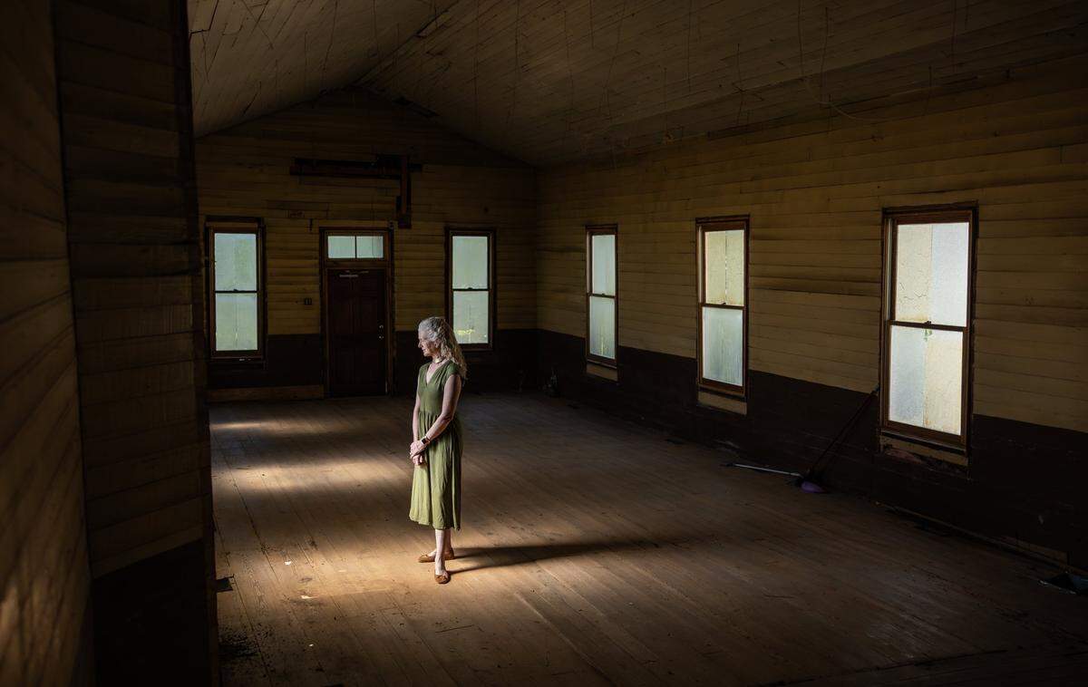 Abigail Jennings, a member of the HEARTS Collaborative, stands inside The Brevard’s Chapel United Methodist Church, a 150-year-old church in Denver, NC. The church, the oldest Black church in Lincoln County, is at risk of demolition.