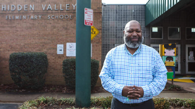 Charlotte teacher didn’t see others like him. Now, he’s packing the school with role models