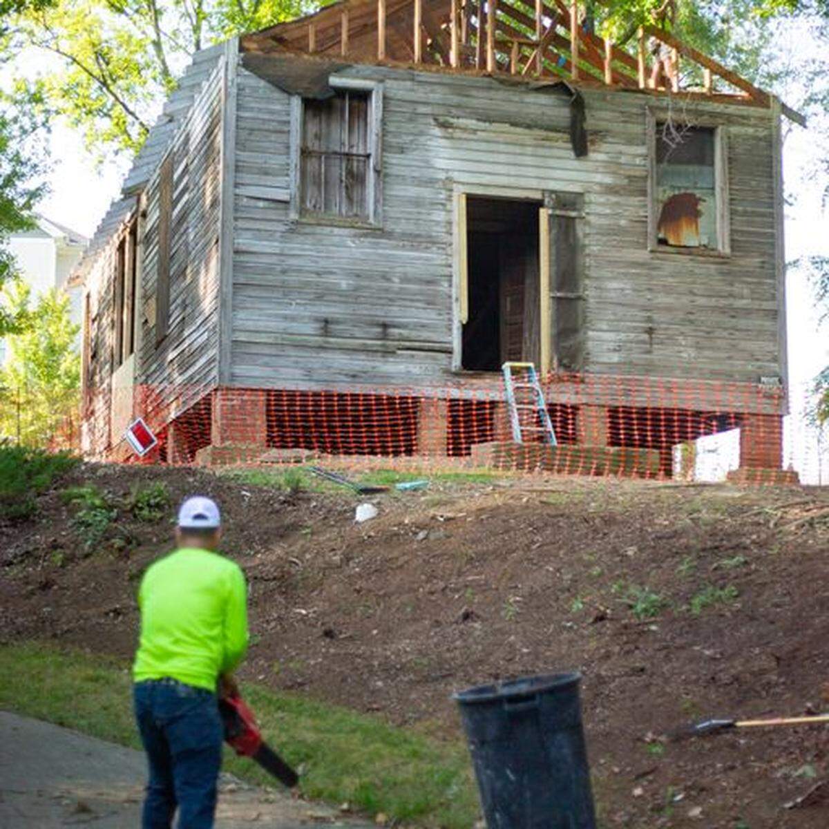 Crews remove the roof from the historic Siloam School ahead of its transport to the Charlotte Museum of History where it will be restored as a community resource to preserve its legacy.