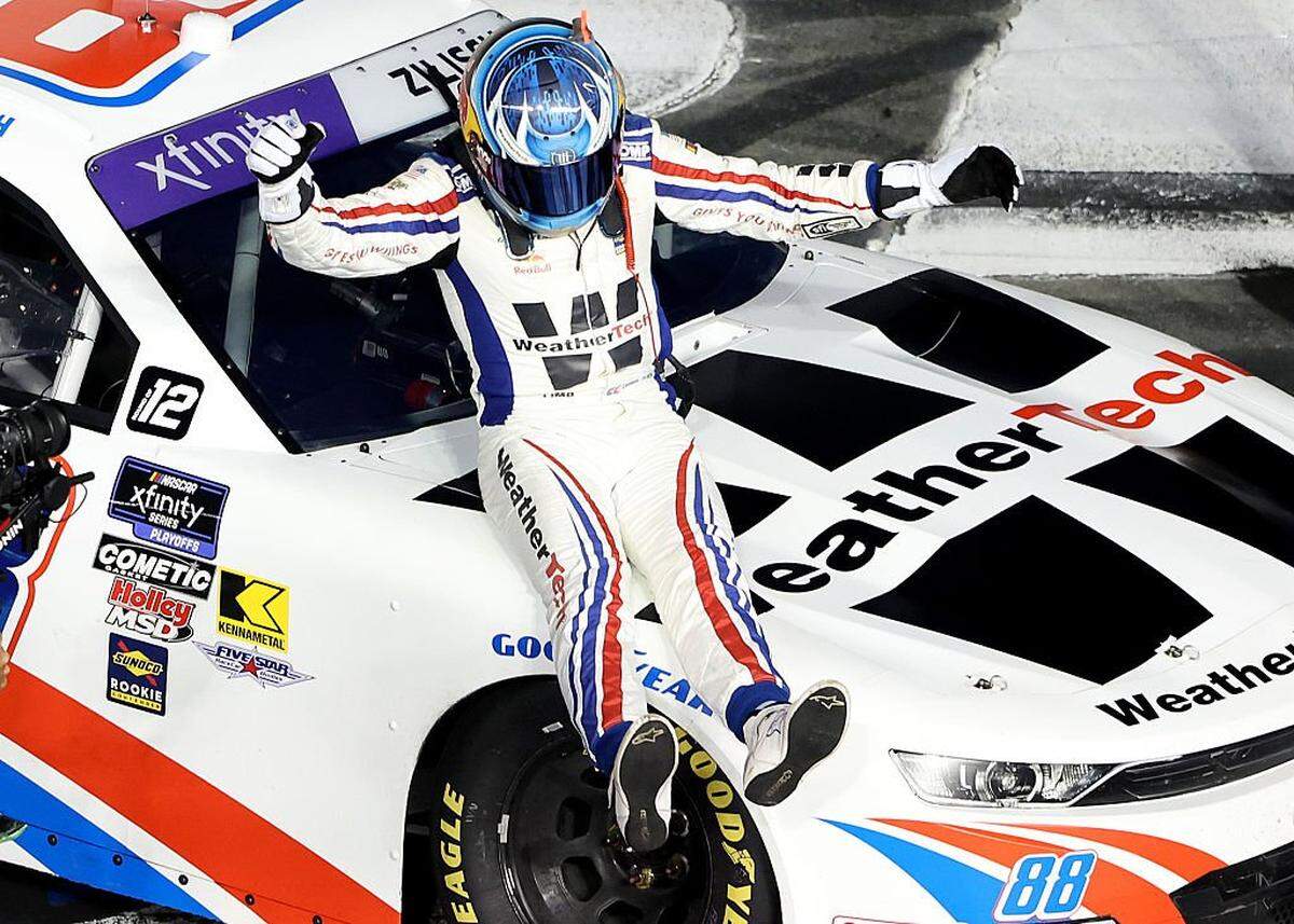 Connor Zilisch, driver of the #88 WeatherTech Chevrolet, celebrates after winning the NASCAR Xfinity Series Blue Cross NC 250 at Charlotte Motor Speedway on Oct. 4, 2025 in Concord, North Carolina.