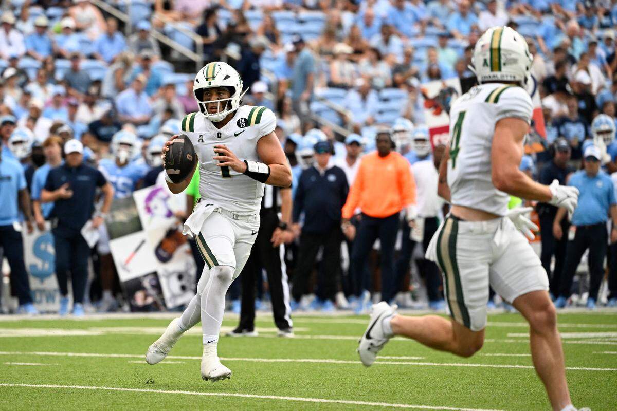 Sep 7, 2024; Chapel Hill, North Carolina, USA; Charlotte 49ers quarterback Max Brown (1) looks to pass in the 1st quarter at Kenan Memorial Stadium. Mandatory Credit: Bob Donnan-Imagn Images