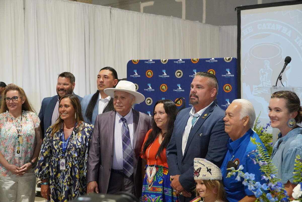 Chief Brian Harris, third from right, poses with attendees and family following the ceremony.