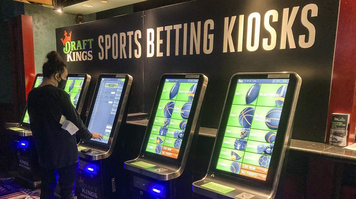 In September 2021, Zach Young, of New Haven, Conn., places a bet at one of the new sports wagering kiosks at Foxwoods Resort Casino in Mashantucket, Conn. More than 30 states have authorized sports gambling since a landmark Supreme Court decision in 2018.