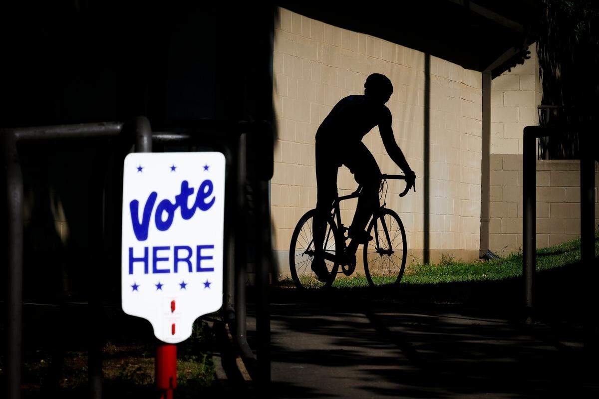 Brian Conroy of Charlotte heads out for his evening ride after voting at the Hawthorne Recreation Center in Charlotte, May 17, 2022.