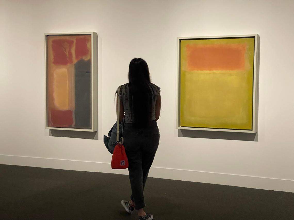 A visitor at Mint Museum Uptown takes in the two Mark Rothko paintings, the first time the museum has had a Rothko to display. These are on long-term loan, from left: “No. 17 [or] No. 15” and “Untitled 1951”.