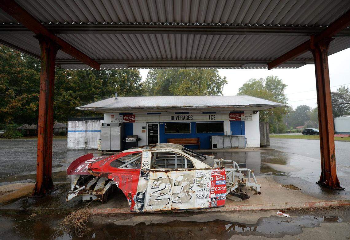 The remains of one of NASCAR driver Jimmy SpencerÕs cars sits under a businesses awning along Highway 115 in North Wilkesboro, NC on Thursday, October 7, 2021.