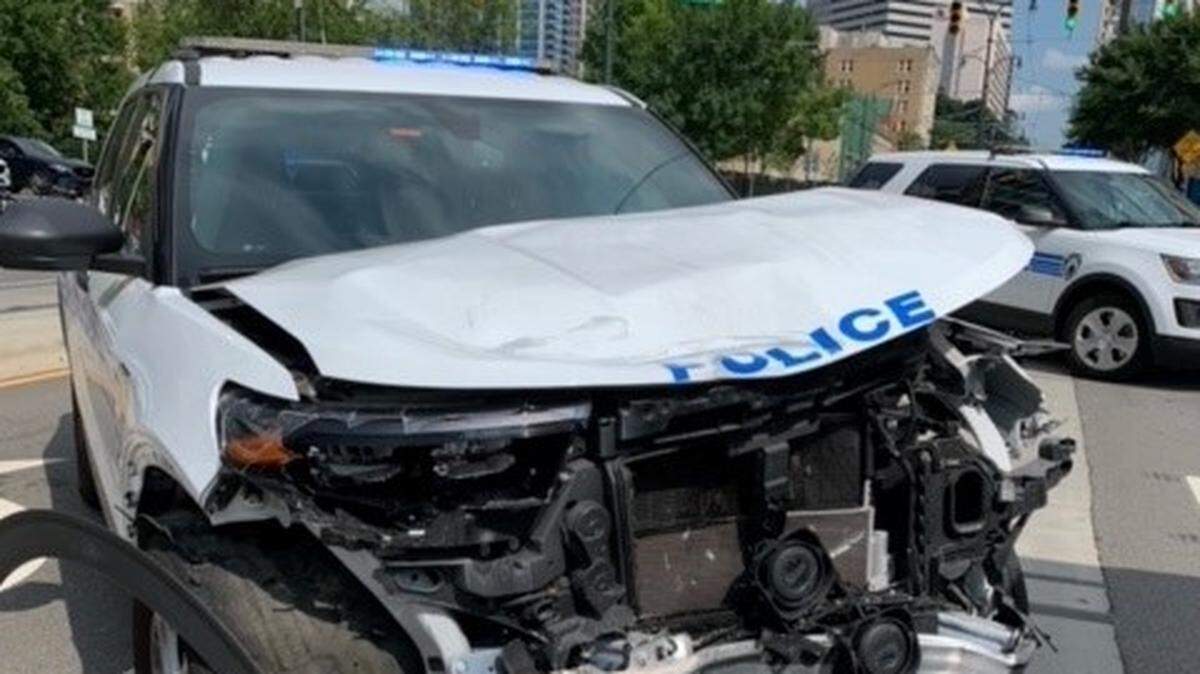 An unidentified Charlotte-Mecklenburg Police officer suffered minor injuries in what the department called an accident at the intersection of Trade and Graham streets in uptown on Thursday, July 7, 2022.