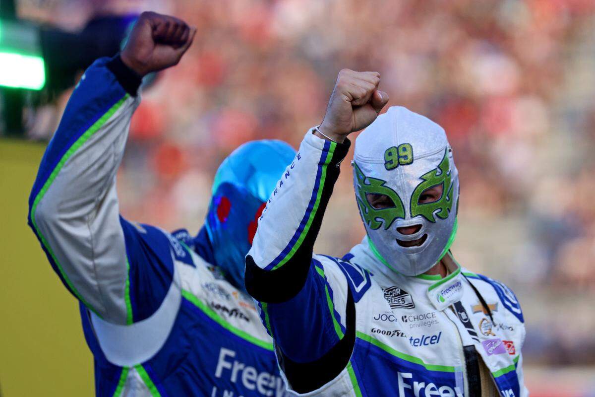 May 18, 2025; North Wilkesboro, North Carolina, USA; NASCAR Cup Series driver Daniel Suarez (99) is introduced before the NASCAR All-Star Open at North Wilkesboro Speedway. Mandatory Credit: Peter Casey-Imagn Images