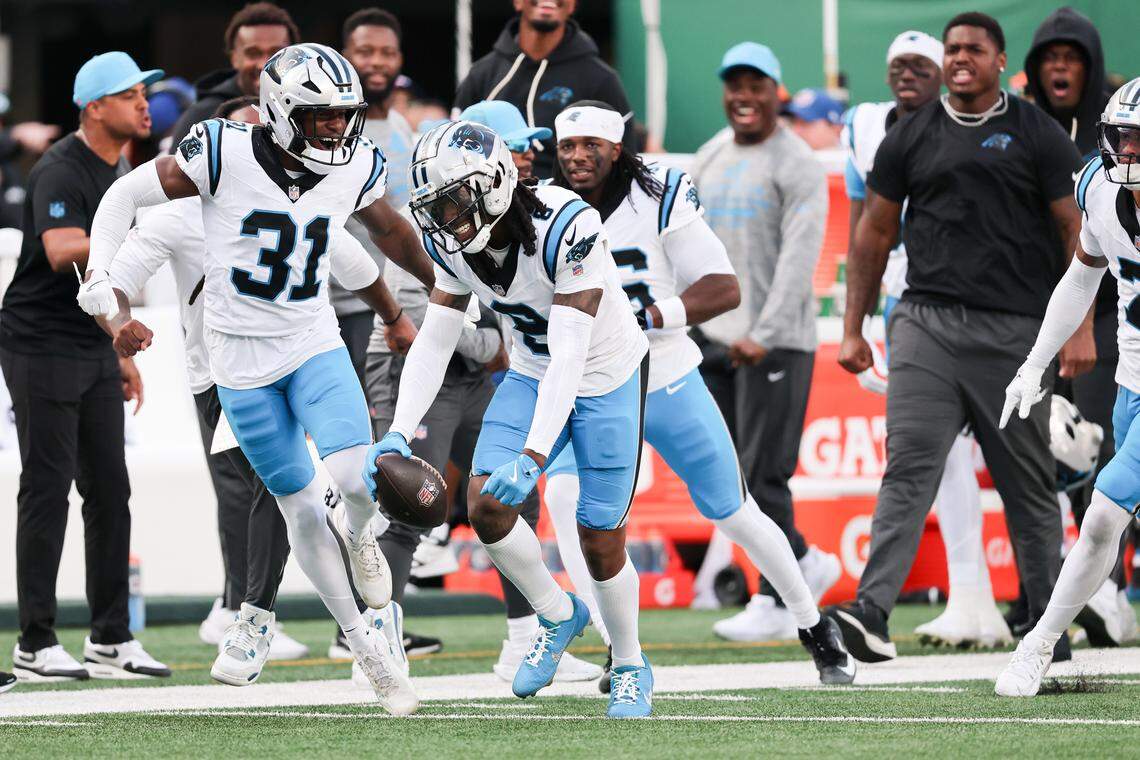 Oct 19, 2025; East Rutherford, New Jersey, USA; Carolina Panthers cornerback Jaycee Horn (8) celebrates an interception intended for New York Jets wide receiver Josh Reynolds (83) in the fourth quarter at MetLife Stadium. Mandatory Credit: Vincent Carchietta-Imagn Images
