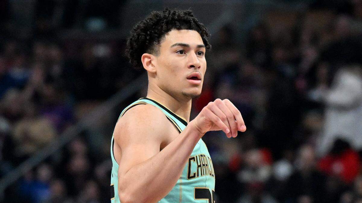 Charlotte Hornets guard KJ Simpson (25) gestures after making a three point basket against the Toronto Raptors in the second half at Scotiabank Arena.