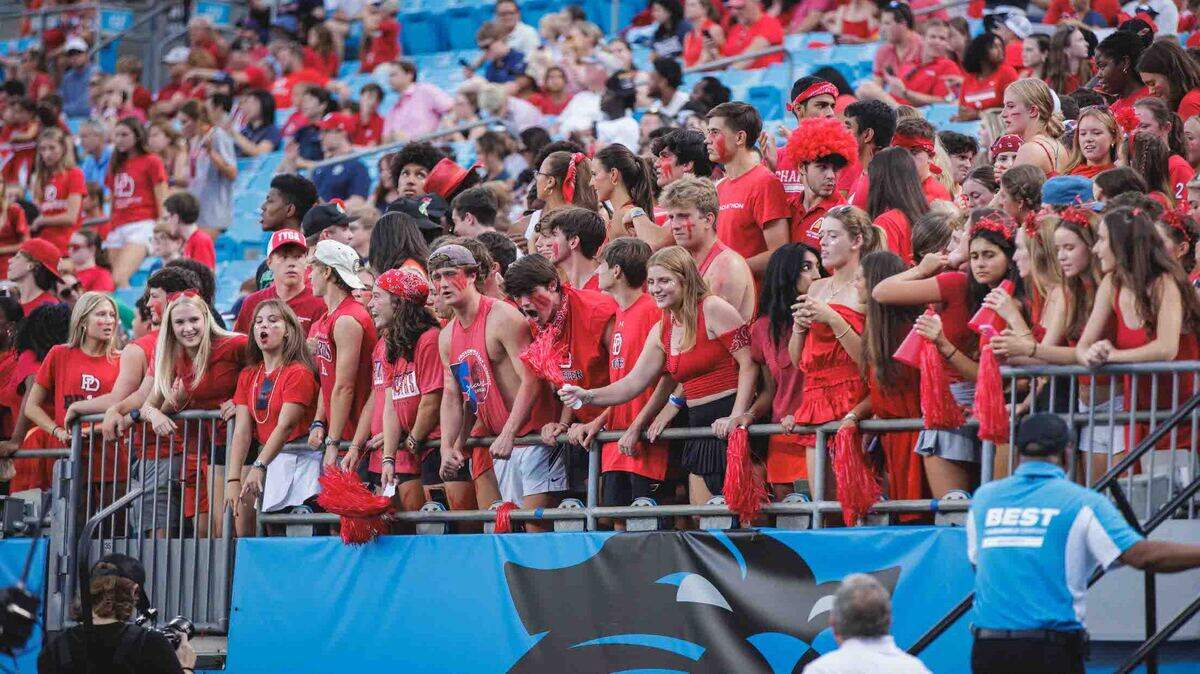 Providence Day fans cheer their team onto victory in what was the first high school game played at Bank of America Stadium in its 27-year history.