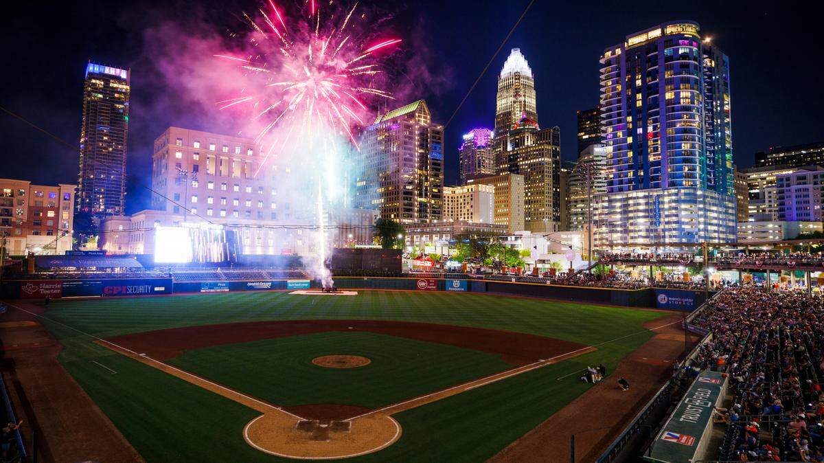 Fireworks illuminate uptown and Truist Field after a Charlotte Knights game in Charlotte, N.C., Friday, April 15, 2022.