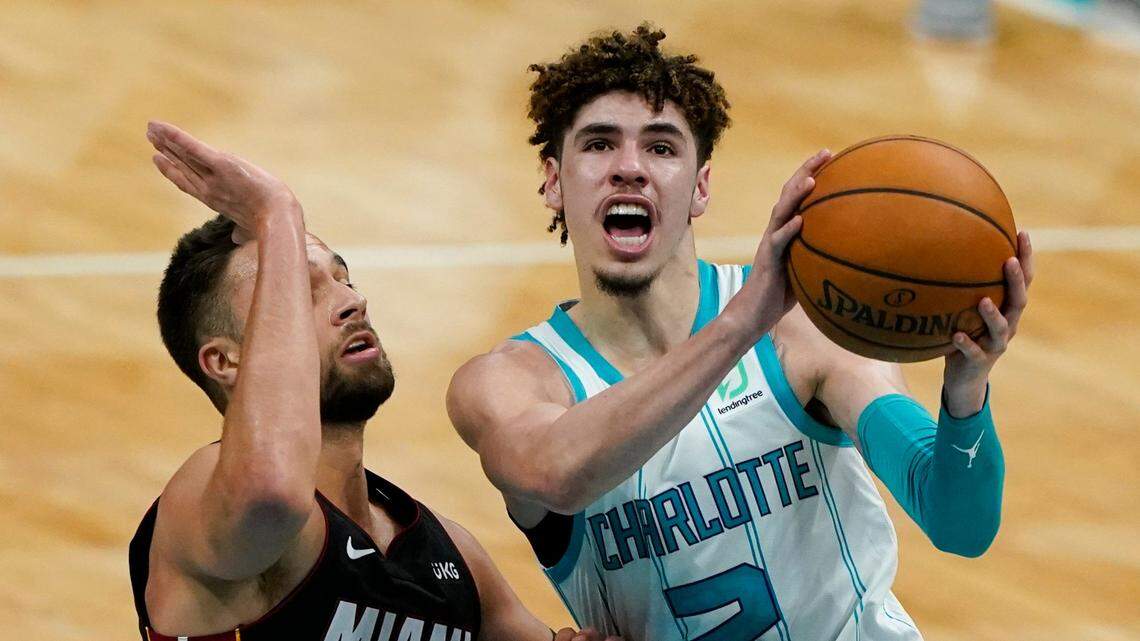 Charlotte Hornets guard LaMelo Ball drives to the basket past Miami Heat guard Max Strus during the second half of Miami’s 121-111 win over Charlotte Sunday.