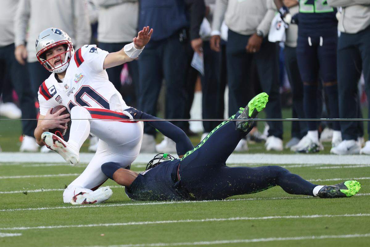 Drake Maye (10) of the New England Patriots is sacked by Nick Emmanwori of the Seattle Seahawks during the first quarter of Super Bowl LX at Levi’s Stadium on Feb. 8, 2026, in Santa Clara, California. 