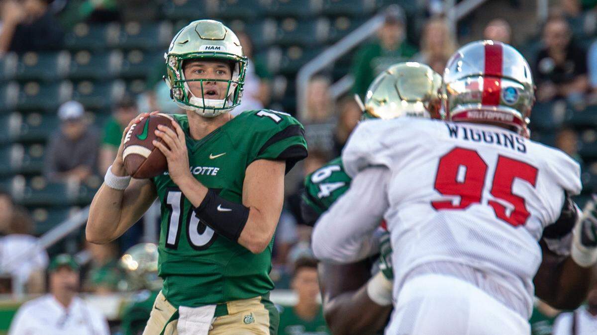 Former Charlotte quarterback Evan Shirreffs, left, spent a month and a half in Australia this year to figure out what he wanted to do with his life after football.