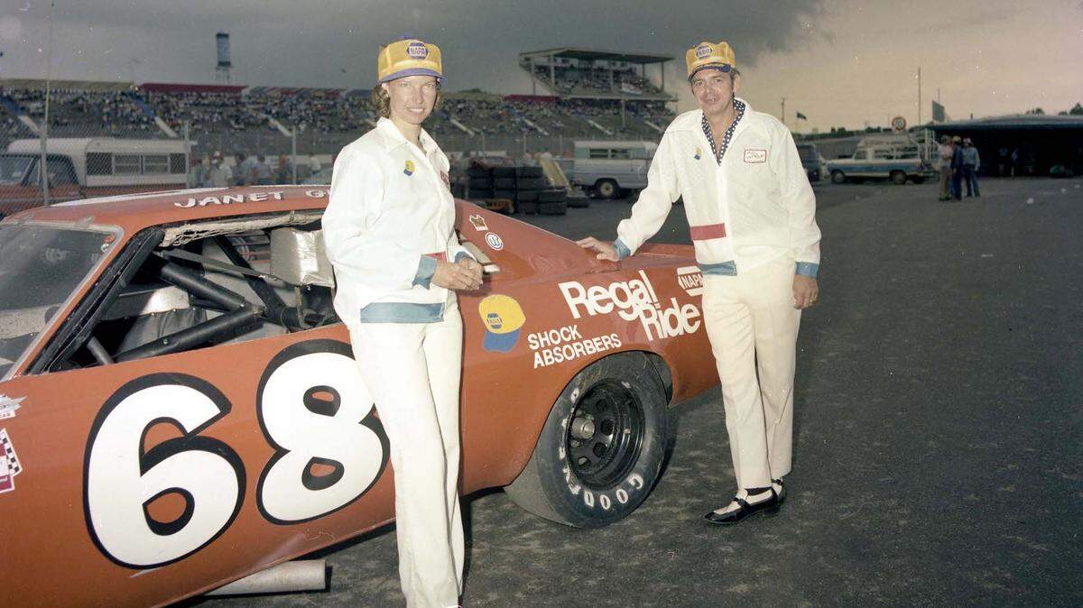 Janet Guthrie stands in front of the No. 68 racecar that Charlotte Motor Speedway officials helped her secure so she could drive in the 1976 World 600. She would finish 15th, beating future hall of fame drivers like Dale Earnhardt Sr. and Bill Elliott. The man standing to Guthrie’s right is unidentified.
