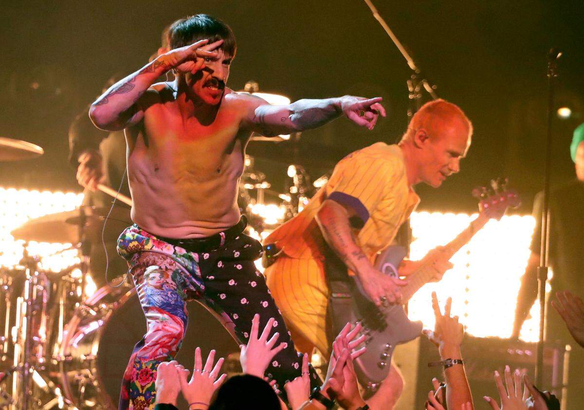 Anthony Kiedis, left, and Flea of Red Hot Chili Peppers perform during the 61st annual Grammy Awards on Feb. 10, 2019, in Los Angeles. The band on Oct. 7, 2021, announced a new world tour.