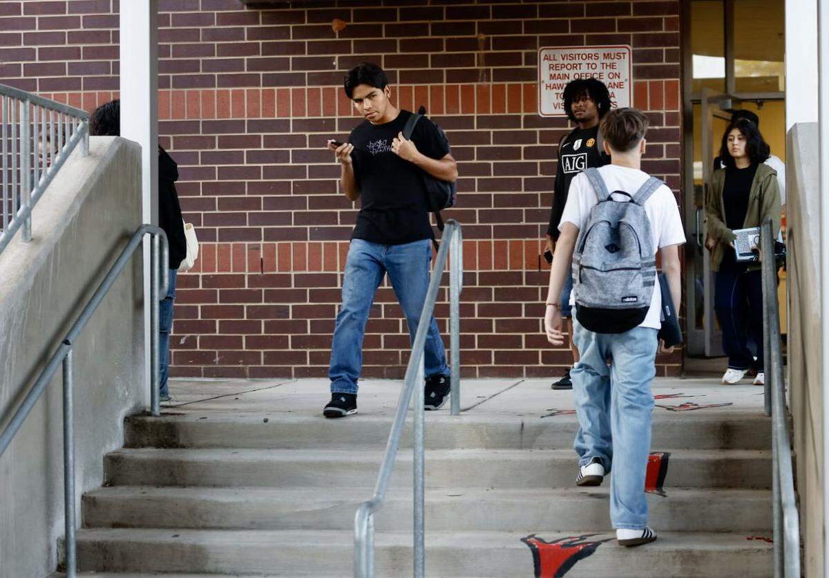 Students walk between classes at Hawthorne Academy of Health Sciences during the first day on Monday, August 26, 2024