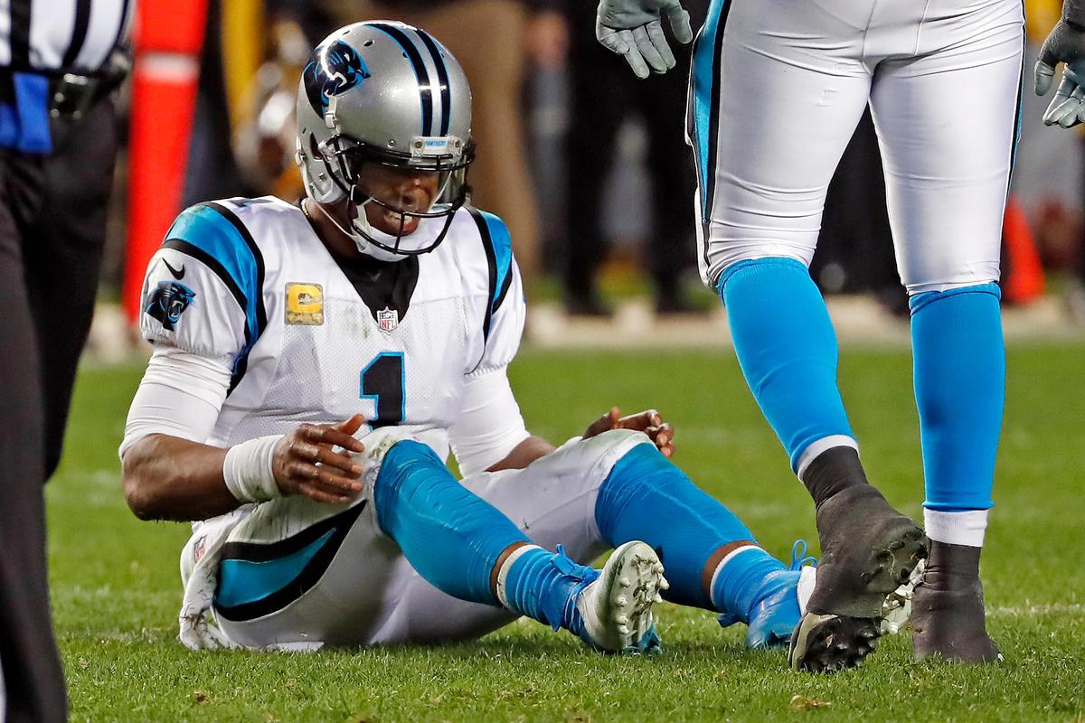 Carolina Panthers quarterback Cam Newton (1) collects himself after fumbling the ball after being hit by Pittsburgh Steelers outside linebacker T.J. Watt (90) during the first half of an NFL football game in Pittsburgh, Thursday, Nov. 8, 2018. Panthers running back Christian McCaffrey recovered the ball. (AP Photo/Keith Srakocic