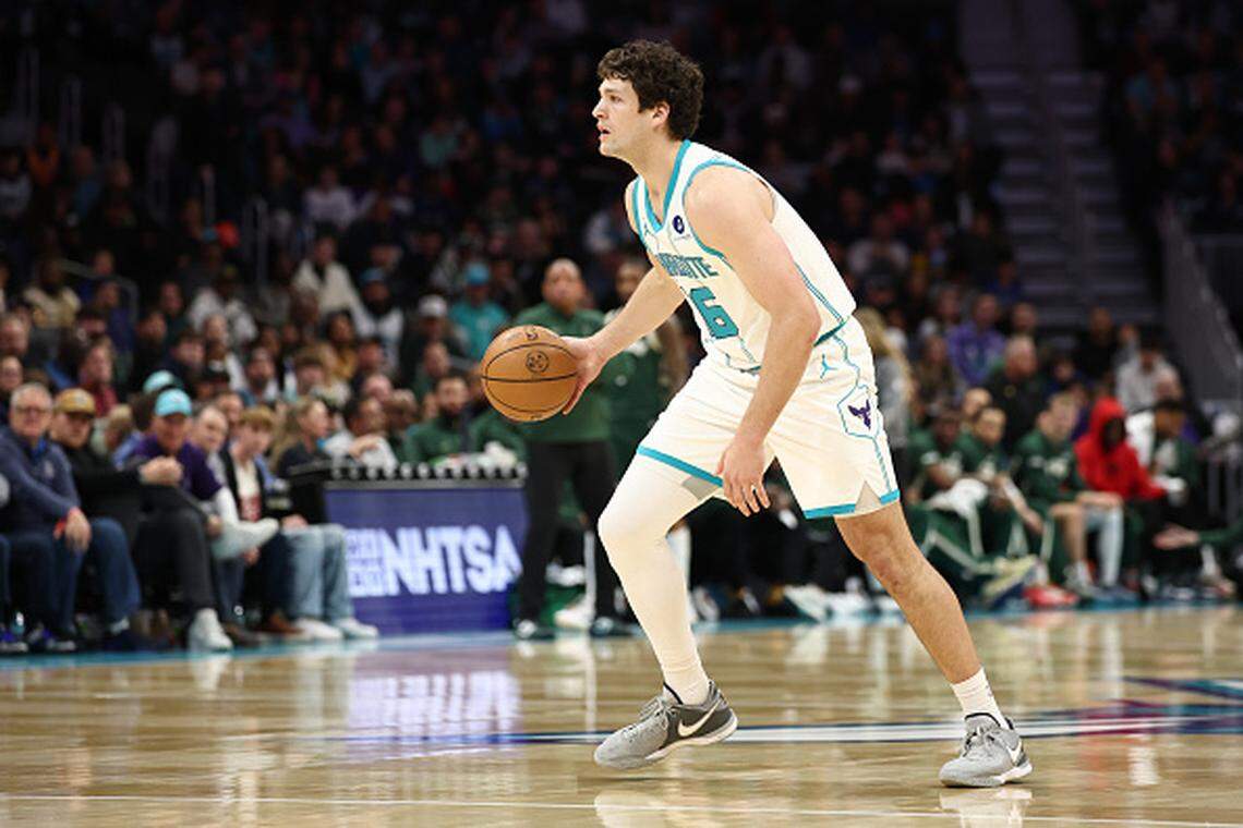 PJ Hall of the Charlotte Hornets dribbles during the first quarter of the game against the Milwaukee Bucks at Spectrum Center.