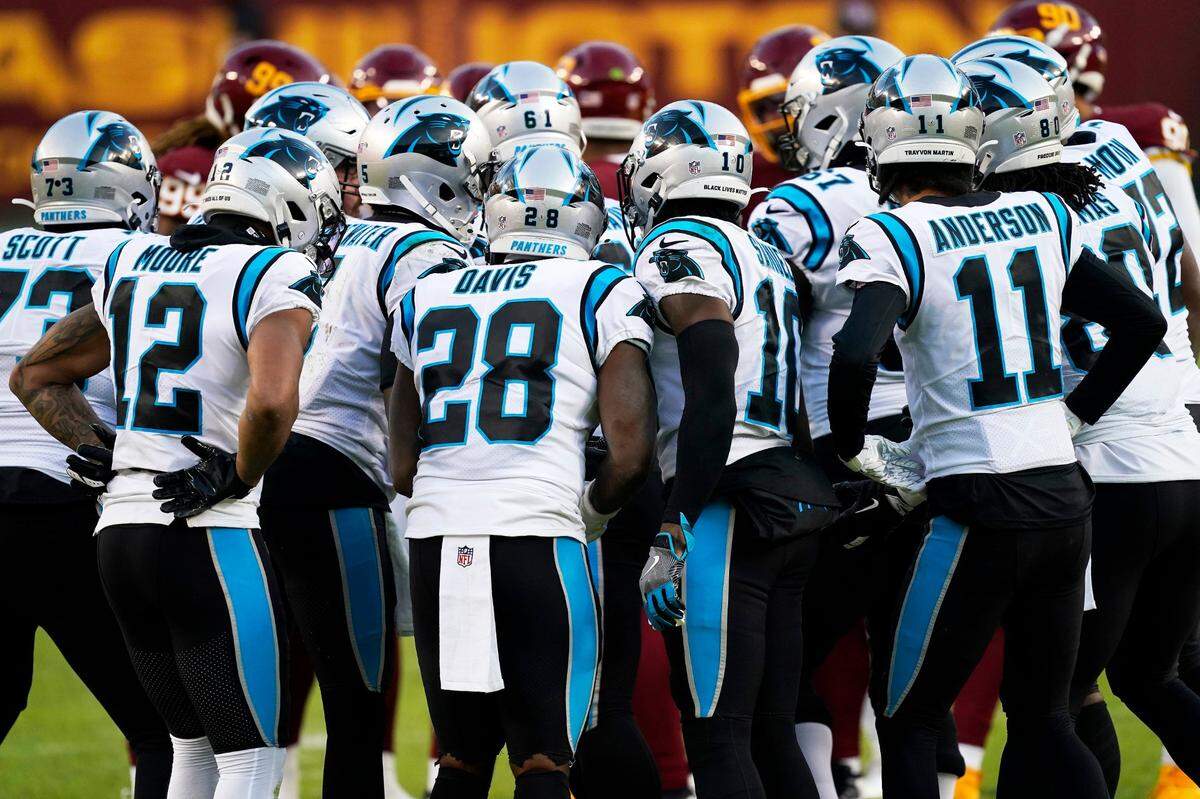 Carolina Panthers offense huddles during an NFL football game against the Washington Football Team, Sunday, Dec. 27, 2020, in Landover, Md. (AP Photo/Mark Tenally)