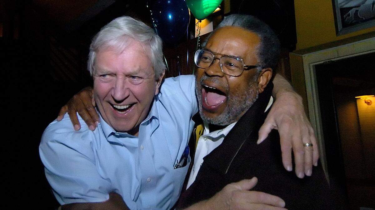 In this file photo, former state Sen. Fountain Odom (left) and former Charlotte City Councilman Malachi Greene celebrate favorable election returns on Tuesday, Nov. 6, 2007. Odoms died this week at age 85.