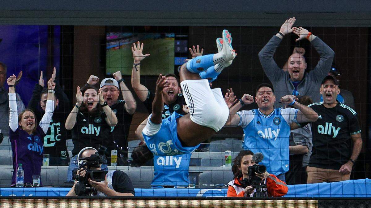 Fans react with jubilation as Charlotte FC forward Kerwin Vargas does a backflip after scoring a goal during the match against Inter Miami at Bank of America Stadium on Saturday, October 21, 2023 in Charlotte, NC. Charlotte FC held onto their lead to defeat Inter Miami, 1-0, clinching a spot in the playoffs.
