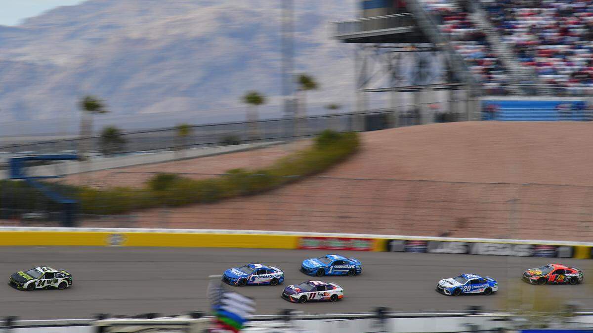 Mar 5, 2023; Las Vegas, Nevada, USA; NASCAR Cup Series driver William Byron (24) leads driver Kyle Larson (5) and the field during the Pennzoil 400 at Las Vegas Motor Speedway. Mandatory Credit: Gary A. Vasquez-USA TODAY Sports