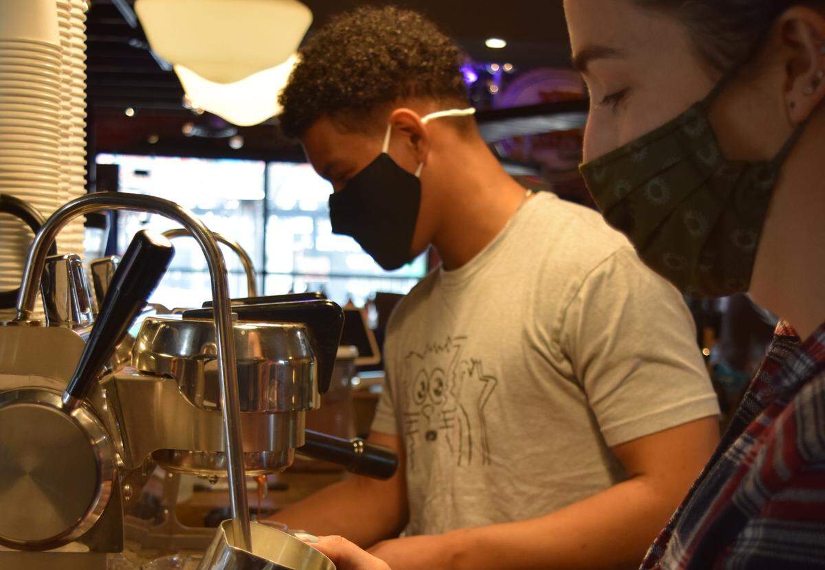 Baristas at Smelly Cat Coffeehouse & Roastery, normally a prime place to make connections, have seen customers adapt to a new normal during COVID-19.