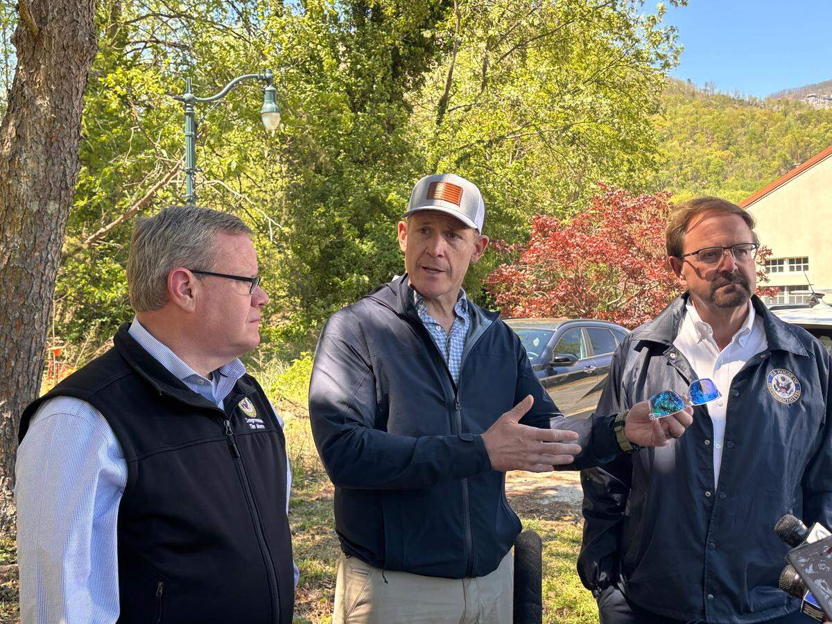 U.S. Rep. Tim Moore, U.S. Sen. Ted Budd, and U.S. Rep. Chuck Edwards speak to press in Lake Lure on April 7 following DHS Secretary Markwayne Mullin’s trip to Western North Carolina.