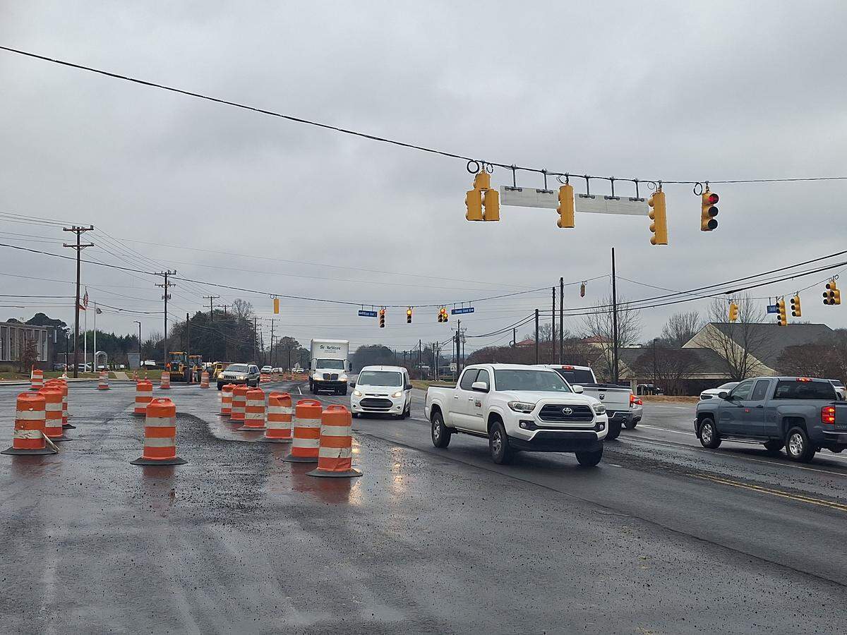 Cars on U.S. 21 in Mooresville pass through the light at Brawley School Road and West Wilson Avenue on Monday. The intersection reopened after a Charlotte contractor finished safety improvements three months early.